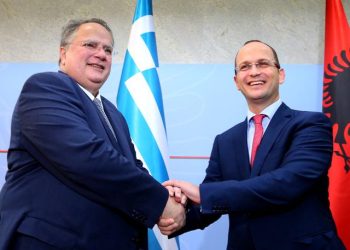 Greek Foreign Minister Nikos Kotzias, left, shakes hands with Albanian Minister of Foreign Affairs Ditmir Bushati prior to their meeting in Tirana, Wednesday, July 15, 2015. (AP Photo/Hektor Pustina)