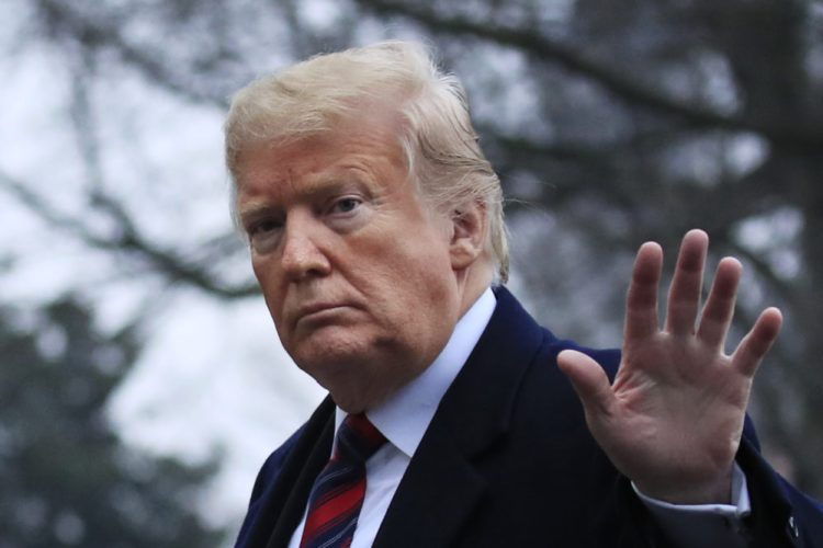 President Donald Trump walks on the South Lawn upon arrival at the White House in Washington, Saturday, Jan. 19, 2019, after attending the casualty return at Dover Air Force Base, Del., for the four Americans killed in a suicide bomb attack in Syria. (AP Photo/Manuel Balce Ceneta)