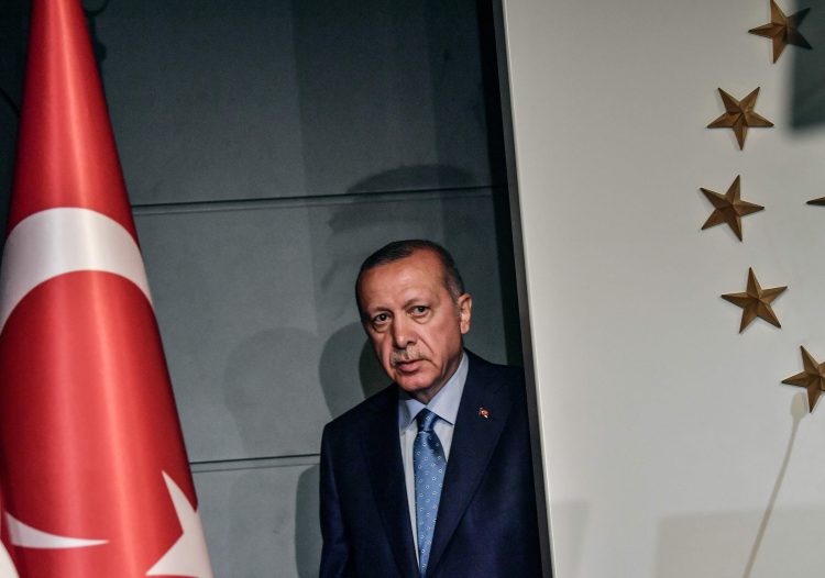 TOPSHOT - Turkish President Recep Tayyip Erdogan arrives to deliver a speech on June 24, 2018 in Istanbul, after initial results of Turkey's presidential and parliamentary elections. 
Erdogan on June 24 declared victory in a tightly-contested presidential election, extending his 15-year grip on power in the face of a revitalised opposition. Turkish voters had for the first time cast ballots for both president and parliament in the snap polls, with Erdogan looking for a first round knockout and an overall majority for his ruling Justice and Development Party (AKP). / AFP PHOTO / BULENT KILICBULENT KILIC/AFP/Getty Images