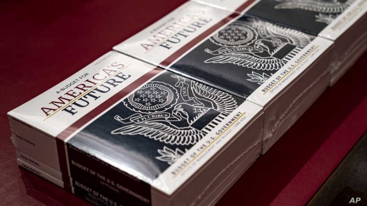 President Donald Trump's budget request for fiscal year 2021 arrives at the House Budget Committee on Capitol Hill in Washington, Monday, Feb. 10, 2020. (AP Photo/J. Scott Applewhite)