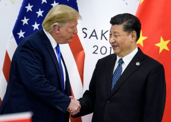 (FILES) In this file photo taken on June 28, 2019, China's President Xi Jinping (R) shakes hands with US President Donald Trump before a bilateral meeting on the sidelines of the G20 Summit in Osaka. - From the Arab Spring to bloodletting in Syria, from Obama to Trump, from terror in the streets of Paris to Brexit, the 2010s began with hope for a more equitable world, and end with a slide towards nationalistic populism. (Photo by Brendan Smialowski / AFP) (Photo by BRENDAN SMIALOWSKI/AFP via Getty Images)