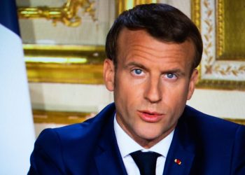 French President Emmanuel Macron is seen on a TV screen in Paris, as he speaks from the Elysee Palace during a televised address to the nation on April 13, 2020, on the 28th day of a lockdown in France aimed at curbing the spread of the COVID-19 pandemic, caused by the novel coronavirus. The French president in a prime-time televised address announced the coronavirus lockdown in place since March 17, 2020, will go on until May 11, while also outlining how the country will take steps to recover. Photo by Raphael Lafargue/ABACAPRESS.COM