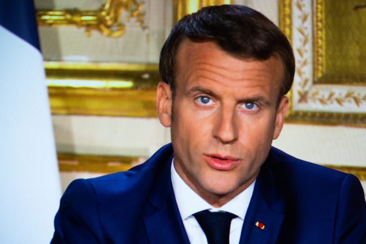 French President Emmanuel Macron is seen on a TV screen in Paris, as he speaks from the Elysee Palace during a televised address to the nation on April 13, 2020, on the 28th day of a lockdown in France aimed at curbing the spread of the COVID-19 pandemic, caused by the novel coronavirus. The French president in a prime-time televised address announced the coronavirus lockdown in place since March 17, 2020, will go on until May 11, while also outlining how the country will take steps to recover. Photo by Raphael Lafargue/ABACAPRESS.COM