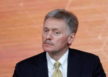 FILE PHOTO: Kremlin spokesman Dmitry Peskov listens during Russian President Vladimir Putin's annual end-of-year news conference in Moscow, Russia December 19, 2019. REUTERS/Evgenia Novozhenina