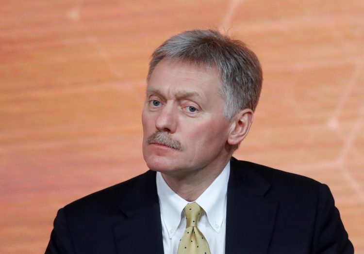 FILE PHOTO: Kremlin spokesman Dmitry Peskov listens during Russian President Vladimir Putin's annual end-of-year news conference in Moscow, Russia December 19, 2019. REUTERS/Evgenia Novozhenina