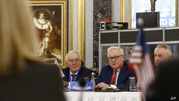 Russian Deputy Foreign Minister Sergey Ryabkov, center, head of a delegation, looks at a U.S. delegation, foreground, as he delivers his opening remarks during a Treaty on the Non-Proliferation of Nuclear Weapons (NPT) conference in Beijing Wednesday, Jan. 30, 2019. China is hosting the  meeting of P5 nations. (Thomas Peter/Pool Photo via AP)