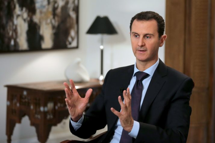 TOPSHOT - Syrian President Bashar al-Assad gestures during an exclusive interview with AFP in the capital Damascus on February 11, 2016.  / AFP / JOSEPH EID        (Photo credit should read JOSEPH EID/AFP/Getty Images)