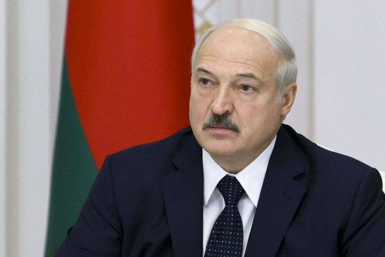 Belarusian President Alexander Lukashenko speaks during a meeting with officials in Minsk, Belarus, Thursday, Aug. 27, 2020. Russian President Vladimir Putin says that his Belarusian counterpart has asked him to provide security assistance to help stabilize the situation in the country if needed, adding that there is no such need yet. Belarus' authoritarian president, Alexander Lukashenko, is facing weeks of protests against his reelection in the Aug. 9 vote, which the opposition say was rigged. (Sergei Sheleg, BelTA Pool via AP)