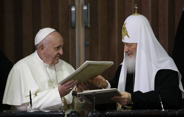FILE -- In this Feb. 12, 2016 file photo, Pope Francis, left, and Russian Orthodox Patriarch Kirill exchange a joint declaration on religious unity at the Jose Marti International airport in Havana, Cuba. Pope Francis is wrapping up a Caucasus pilgrimage that began in June in Armenia and ends this weekend with a visit to two other countries with tiny Catholic communities: the Orthodox Christian bastion of Georgia and the largely Shiite Muslim nation of Azerbaijan. (AP Photo/Gregorio Borgia, Pool)