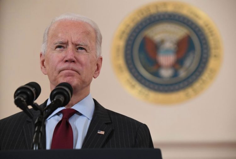 US President Joe Biden speaks about lives lost to Covid after death toll passed 500,000, in the Cross Hall of the White House in Washington, DC, February 22, 2021. (Photo by SAUL LOEB / AFP) (Photo by SAUL LOEB/AFP via Getty Images)