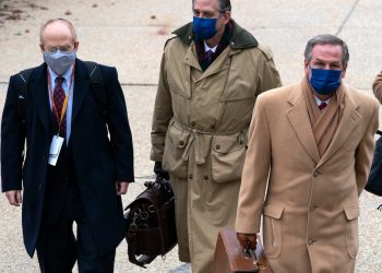 From left, David Schoen, Bruce Castor and Michael van der Veen, lawyers for former President Donald Trump, arrive at the Capitol on the third day of the second impeachment trial of Trump in the Senate, Thursday, Feb. 11, 2021, in Washington. (AP Photo/Jose Luis Magana)