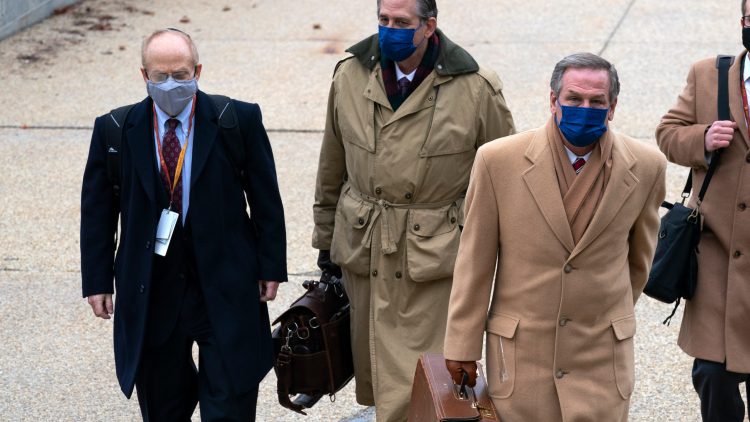 From left, David Schoen, Bruce Castor and Michael van der Veen, lawyers for former President Donald Trump, arrive at the Capitol on the third day of the second impeachment trial of Trump in the Senate, Thursday, Feb. 11, 2021, in Washington. (AP Photo/Jose Luis Magana)