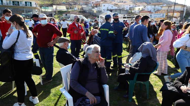Local residents gather at a soccer field after an earthquake in Mesochori village, central Greece, Wednesday, March 3, 2021. An earthquake with a preliminary magnitude of up to 6.3 struck central Greece on Wednesday and was felt as far away as the capitals of neighboring Albania, North Macedonia, Kosovo and Montenegro. (AP Photo/Vaggelis Kousioras)