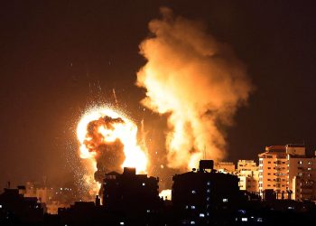 TOPSHOT - Fire billow from Israeli air strikes in the Gaza Strip, controlled by the Palestinian Islamist movement Hamas, on May 10, 2021. - Israel launched deadly air strikes on Gaza in response to a barrage of rockets fired by the Islamist movement Hamas amid spiralling violence sparked by unrest at Jerusalem's Al-Aqsa Mosque compound. (Photo by MAHMUD HAMS / AFP)