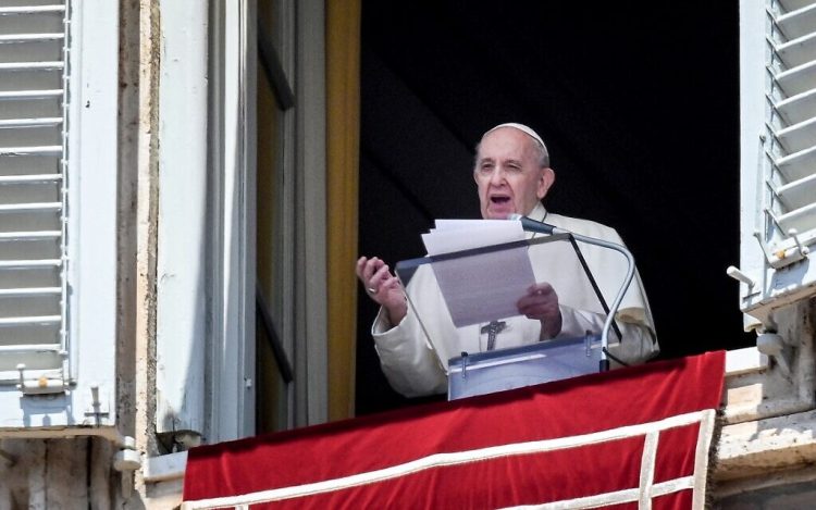 Pope Francis speaks from a window of the apostolic palace overlooking St. Peter's Square in the Vatican during the weekly Angelus prayer followed by the recitation of the Regina Coeli on May 09, 2021. (Photo by Vincenzo PINTO / AFP)