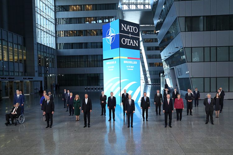 NATO leaders pose for a group photo during a NATO summit in Brussels, Monday, June 14, 2021. U.S. President Joe Biden is taking part in his first NATO summit, where the 30-nation alliance hopes to reaffirm its unity and discuss increasingly tense relations with China and Russia, as the organization pulls its troops out after 18 years in Afghanistan. (Yves Herman, Pool via AP)