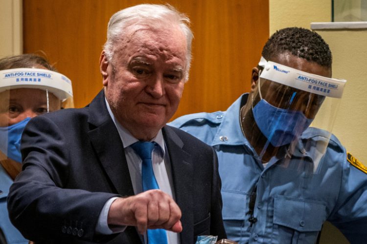 Former Bosnian Serb military leader Ratko Mladic stands prior to the pronouncement of his appeal judgement at the UN International Residual Mechanism for Criminal Tribunals (IRMCT) in The Hague, Netherlands June 8, 2021. Jerry Lampen/Pool via REUTERS