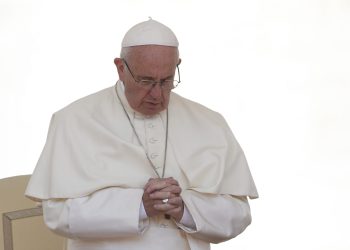 Pope Francis prays as he leads a special audience for military members and their families in St. Peter's Square at the Vatican April 30. (CNS photo/Paul Haring) See POPE-AUDIENCE-RECONCILE May 2, 2016.