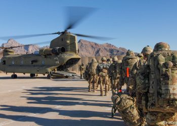 Soldiers attached to the 101st Resolute Support Sustainment Brigade, Iowa National Guard and 10th Mountain, 2-14 Infantry Battalion, load onto a Chinook helicopter to head out on a mission in Afghanistan, January 15, 2019.     1st Lt. Verniccia Ford/U.S. Army/Handout via REUTERS   ATTENTION EDITORS - THIS IMAGE WAS PROVIDED BY A THIRD PARTY. - RC110D3B25B0