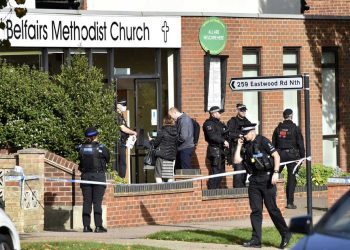 Emergency services at the scene near the Belfairs Methodist Church in Eastwood Road North, where Conservative MP Sir David Amess has reportedly been stabbed several times at a constituency surgery, in Leigh-on-Sea, Essex, England, Friday, Oct. 15, 2021. British police say a man has been arrested after a reported stabbing in eastern England. News outlets say the victim is Conservative lawmaker David Amess. The Essex Police force said officers were called to reports of a stabbing in Leigh-on-Sea just after noon Friday. It said “a man was arrested shortly after & we’re not looking for anyone else.” (Nick Ansell/PA via AP)