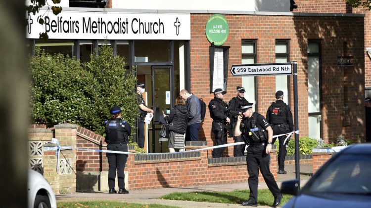 Emergency services at the scene near the Belfairs Methodist Church in Eastwood Road North, where Conservative MP Sir David Amess has reportedly been stabbed several times at a constituency surgery, in Leigh-on-Sea, Essex, England, Friday, Oct. 15, 2021. British police say a man has been arrested after a reported stabbing in eastern England. News outlets say the victim is Conservative lawmaker David Amess. The Essex Police force said officers were called to reports of a stabbing in Leigh-on-Sea just after noon Friday. It said “a man was arrested shortly after & we’re not looking for anyone else.” (Nick Ansell/PA via AP)