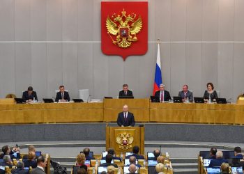 Russia's President Vladimir Putin and acting Prime Minister Dmitry Medvedev attend a session of the State Duma in Moscow on May 8, 2018.
Russia's lower house of parliament votes on Dmitry Medvedev's candidacy for the post of Prime Minister. / AFP PHOTO / Yuri KADOBNOV