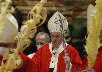 Pope Francis is pictured as cardinals walk in procession at the conclusion of Palm Sunday Mass in St. Peter's Basilica at the Vatican March 28, 2021. (CNS photo/Paul Haring)