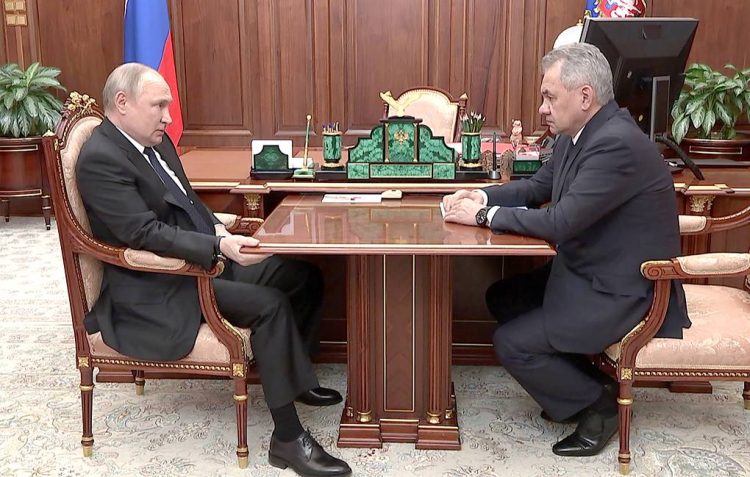 MOSCOW, RUSSIA  APRIL 21, 2022: Russia's President Vladimir Putin and Defence Minister Sergei Shoigu talk during a meeting in the Kremlin. Shoigu reported about Russian troops and the DPR People's Militia taking control of the city of Mariupol. Russian Presidential Press and Information Office/TASS

Ðîññèÿ. Ìîñêâà. Ïðåçèäåíò ÐÔ Âëàäèìèð Ïóòèí è ìèíèñòð îáîðîíû ÐÔ Ñåðãåé Øîéãó (ñëåâà íàïðàâî) âî âðåìÿ âñòðå÷è â Êðåìëå, íà êîòîðîé áûëî äîëîæåíî îá îñâîáîæäåíèè Ìàðèóïîëÿ âîîðóæåííûìè ñèëàìè ÐÔ è ÄÍÐ. Ïðåññ-ñëóæáà ïðåçèäåíòà ÐÔ/ÒÀÑÑ