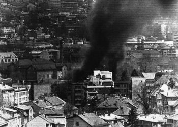 Twenty years ago this week, the Bosnian war began with the siege of Sarajevo, the capital. In this photo, smoke billows from a building in downtown Sarajevo, April 22, 1992, after a Serbian mortar attack.