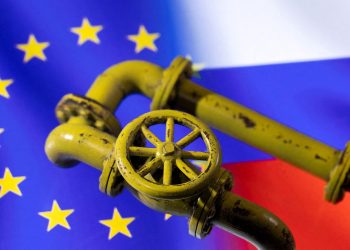 FILE PHOTO: A 3D printed Natural Gas Pipes are placed on displayed EU and Russian flags in this illustration taken, January 31, 2022. REUTERS/Dado Ruvic