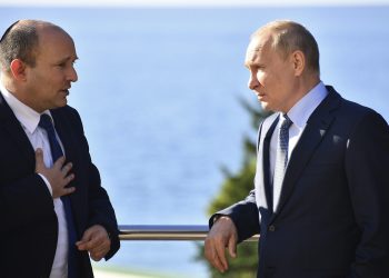 Russian President Vladimir Putin, right, and Israeli Prime Minister Naftali Bennett speak during their meeting in Sochi, Russia, Friday, Oct. 22, 2021. Russian President Vladimir Putin hosted Israeli Prime Minister Naftali Bennett Friday for their first meeting, hailing friendly ties between the two countries. (Evgeny Biyatov, Sputnik, Kremlin Pool Photo via AP)