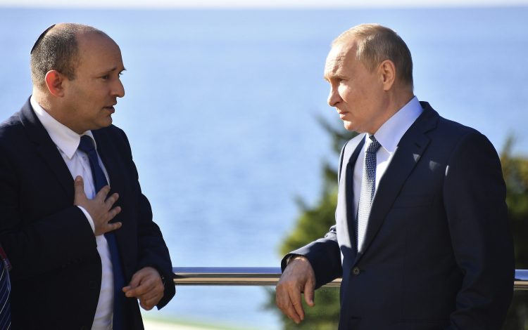 Russian President Vladimir Putin, right, and Israeli Prime Minister Naftali Bennett speak during their meeting in Sochi, Russia, Friday, Oct. 22, 2021. Russian President Vladimir Putin hosted Israeli Prime Minister Naftali Bennett Friday for their first meeting, hailing friendly ties between the two countries. (Evgeny Biyatov, Sputnik, Kremlin Pool Photo via AP)