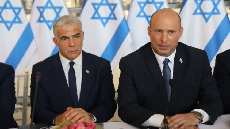 Israeli Prime Minister Naftali Bennett (R) and Foreign Minister Yair Lapid, attend a weekly cabinet meeting in Jerusalem, on May 29, 2022. (Photo by GIL COHEN-MAGEN / POOL / AFP) (Photo by GIL COHEN-MAGEN/POOL/AFP via Getty Images)