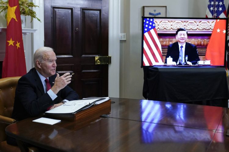 FILE - President Joe Biden meets virtually with Chinese President Xi Jinping from the Roosevelt Room of the White House in Washington, on Nov. 15, 2021.  (AP Photo/Susan Walsh, File)