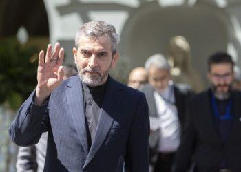 Iran's chief nuclear negotiator Ali Bagheri Kani waves as he leaves after talks at the Coburg Palais, the venue of the Joint Comprehensive Plan of Action (JCPOA) in Vienna on August 4, 2022. - The United States and the European Union's Iran nuclear envoys on August 3, 2022 said they were travelling to Vienna for talks with Tehran's delegation as they seek to salvage the agreement on its atomic ambitions. (Photo by Alex HALADA / AFP)