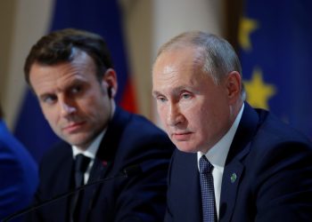 FILE PHOTO: French President Emmanuel Macron and Russia's President Vladimir Putin attend a joint news conference after a Normandy-format summit in Paris, France, December 9, 2019. REUTERS/Charles Platiau/Pool?