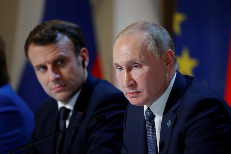 FILE PHOTO: French President Emmanuel Macron and Russia's President Vladimir Putin attend a joint news conference after a Normandy-format summit in Paris, France, December 9, 2019. REUTERS/Charles Platiau/Pool?