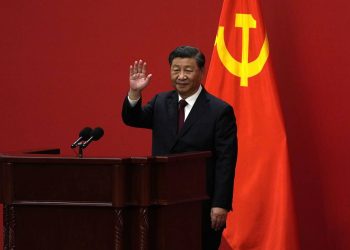 Chinese President Xi Jinping waves at an event to introduce new members of the Politburo Standing Committee at the Great Hall of the People in Beijing, Sunday, Oct. 23, 2022. (AP Photo/Andy Wong)