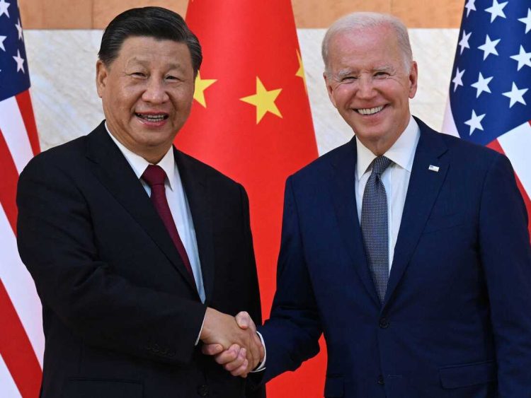 TOPSHOT - US President Joe Biden (R) and China's President Xi Jinping (L) shake hands as they meet on the sidelines of the G20 Summit in Nusa Dua on the Indonesian resort island of Bali on November 14, 2022. (Photo by SAUL LOEB / AFP) (Photo by SAUL LOEB/AFP via Getty Images)
