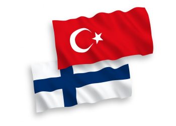 National vector fabric wave flags of Turkey and Finland isolated on white background. 1 to 2 proportion.