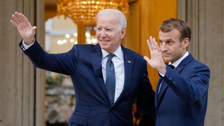 French President Emmanuel Macron (R) welcomes US President Joe Biden (L) before their meeting at the French Embassy to the Vatican in Rome on October 29, 2021. (Photo by Ludovic MARIN / AFP) (Photo by LUDOVIC MARIN/AFP via Getty Images)