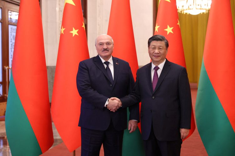 Belarusian President Alexander Lukashenko shakes hands with Chinese President Xi Jinping during a meeting in Beijing, China, March 1, 2023. BelTA/Pavel Orlovsky/Handout via REUTERS