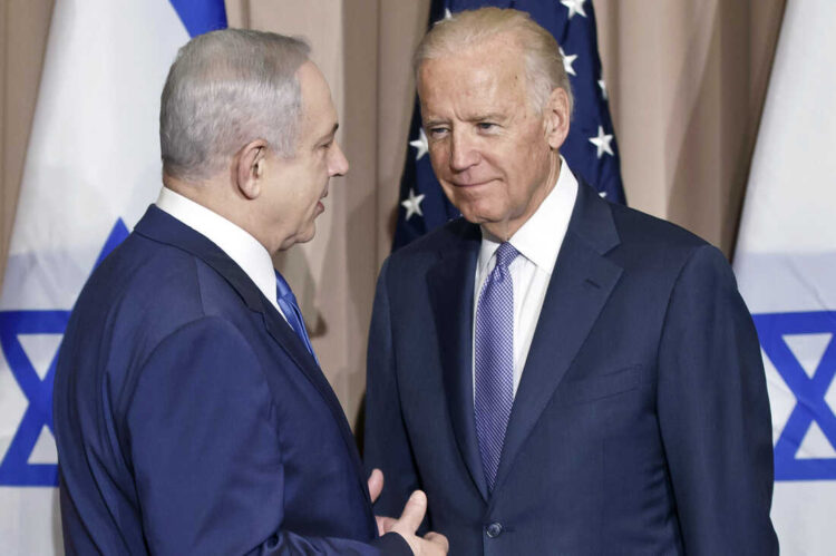FILE - Israeli Prime Minister Benjamin Netanyahu, left, and Vice President Joe Biden talk prior to a meeting on the sidelines of the World Economic Forum in Davos, Switzerland, Jan. 21, 2016. President Joe Biden spoke Sunday, March 19, 2023, with Israeli Prime Minister Benjamin Netanyahu to “express concern” over his government’s planned overhaul of the country’s judicial system that has sparked widespread protests across Israel and to encourage compromise. (AP Photo/Michel Euler, File)