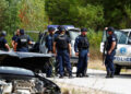 Police officers stand guard in the aftermath of a shooting, near the village of Zvecane, Kosovo September 24, 2023. REUTERS/Ognen Teofilovski