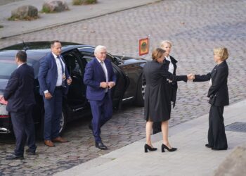 German President Frank-Walter Steinmeier (3rd from left) arrives for the service at Hamburg's main church, Sankt Michaelis. There are a variety of celebrations in the northern German city to mark German Unity Day. Photo: Marcus Brandt/dpa