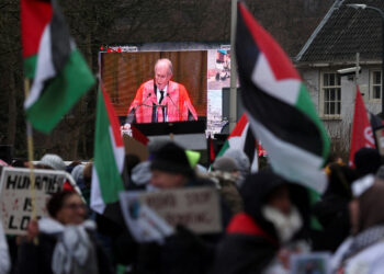 A view of a live broadcast displayed on a street as pro-Palestinian demonstrators protest near the International Court of Justice (ICJ) on the day judges hear a request for emergency measures to order Israel to stop its military actions in Gaza, in The Hague, Netherlands January 11, 2024. REUTERS/Thilo Schmuelgen