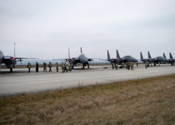 F-15E Strike Eagles with the 336th Fighter Squadron park on the ramp at Campia Turzii, Romania, in support of NATO Enhanced Air Policing mission, Dec. 15, 2021 Campia Turzii, Romania, in support of NATO Enhanced Air Policing, Dec. 15, 2021. U.S. European Command supports NATO allies and partners to strengthen deterrence efforts and adapt through improving readiness and responsiveness as a coalition force. (U.S. Air Force photo by Airman 1st Class Cedrique Oldaker)