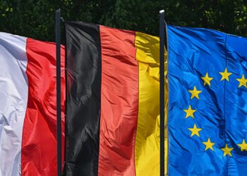 FILED - Flags of Poland, Germany and the EU: The connections between people in Germany and Poland are to become even closer on the initiative of several German federal states. Photo: Patrick Pleul/dpa