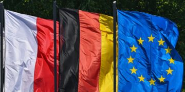 FILED - Flags of Poland, Germany and the EU: The connections between people in Germany and Poland are to become even closer on the initiative of several German federal states. Photo: Patrick Pleul/dpa