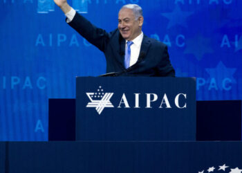 Israeli Prime Minister Benjamin Netanyahu waves to the crowd as he speaks at the 2018 American Israel Public Affairs Committee (AIPAC) policy conference, at Washington Convention Center, Tuesday, March 6, 2018, in Washington. Netanyahu says Iran is responsible for “darkness descending” on the Middle East by building an anti-Israel empire.   (AP Photo/Jose Luis Magana)